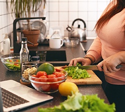 Woman preparing healthy meal at home