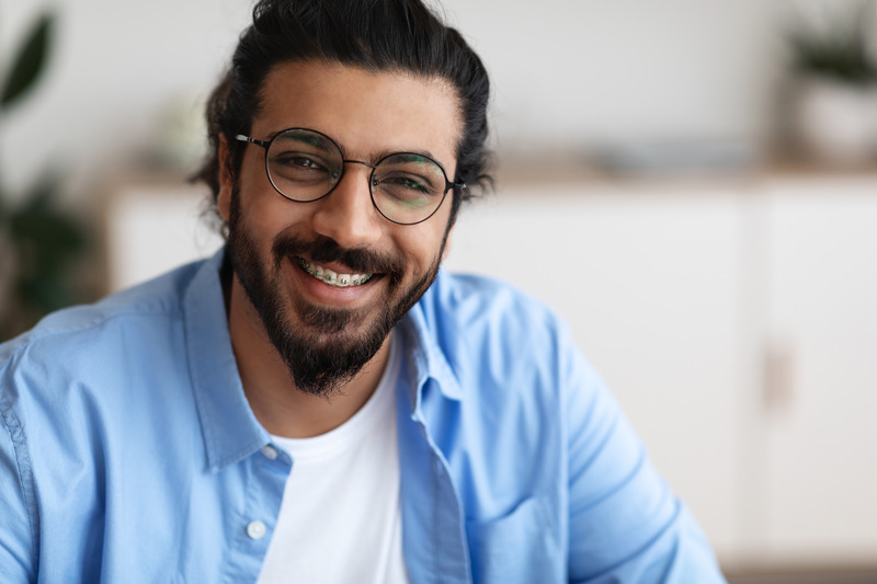 Patient smiling with metal braces